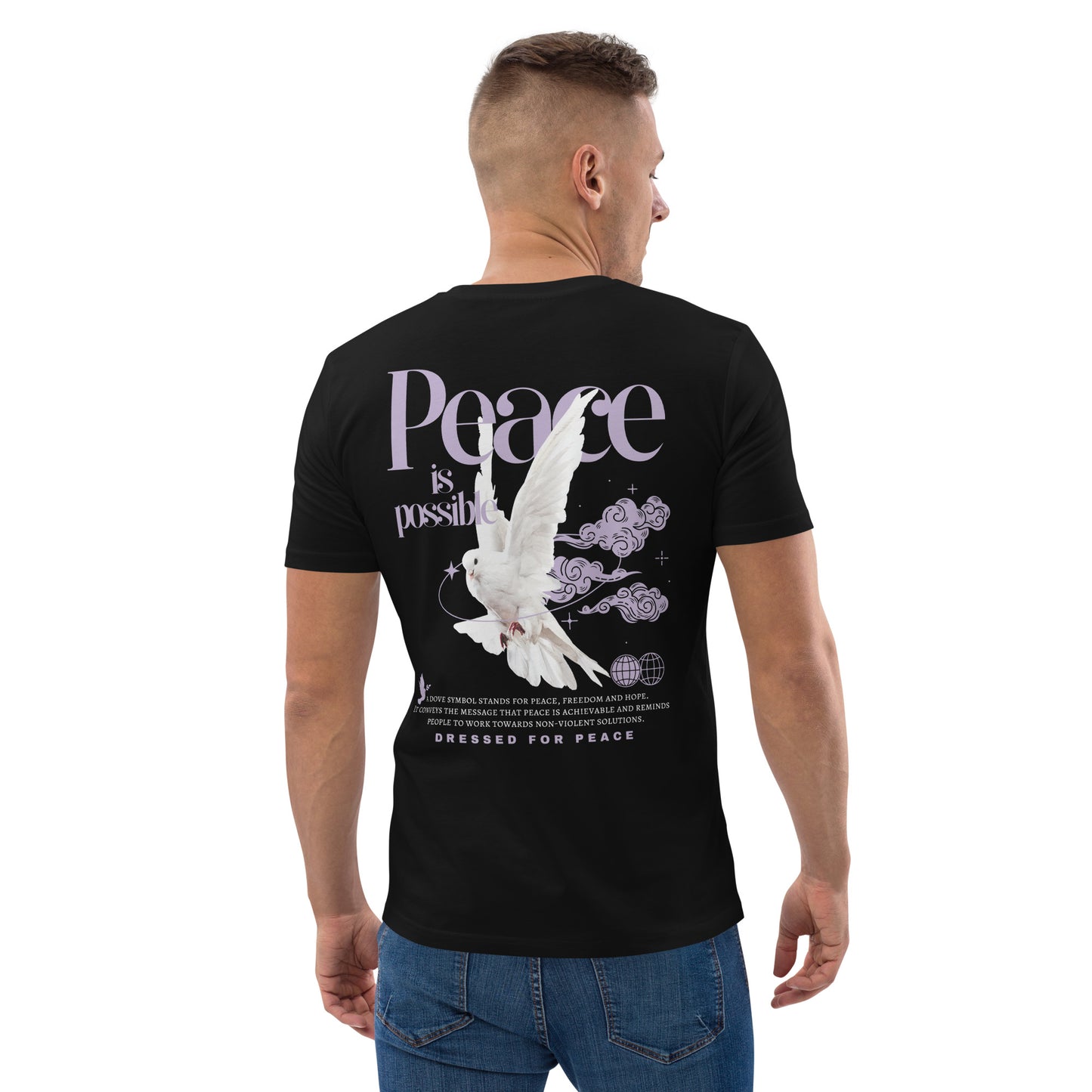 Man wearing a black t-shirt with a peace dove design on the back, featuring the text 'Peace is possible'.