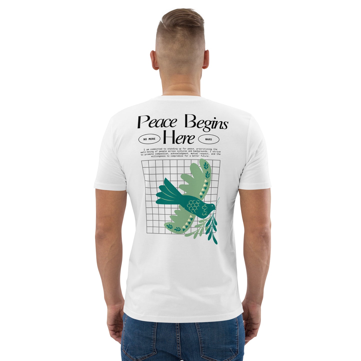 Person wearing a white t-shirt with 'Peace Begins Here' design on the back.
