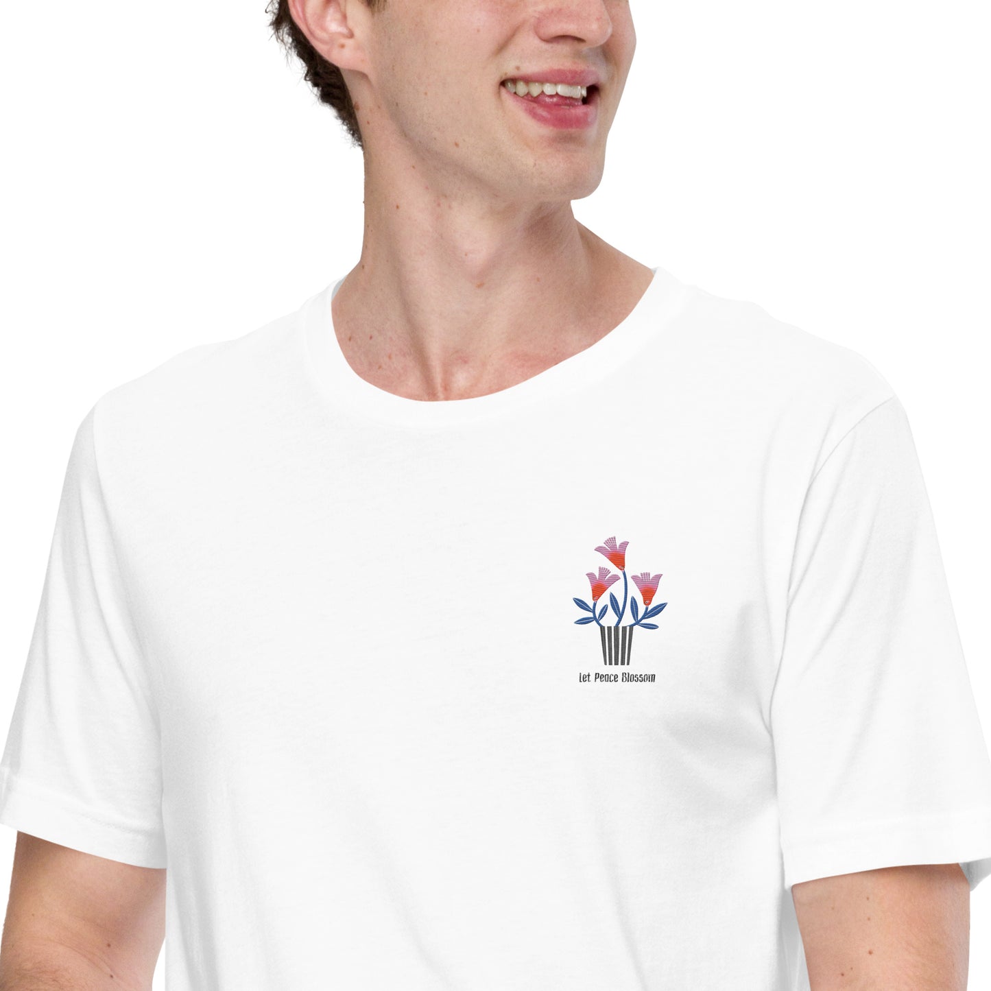 Person wearing a white t-shirt with a colorful flower design on a white background