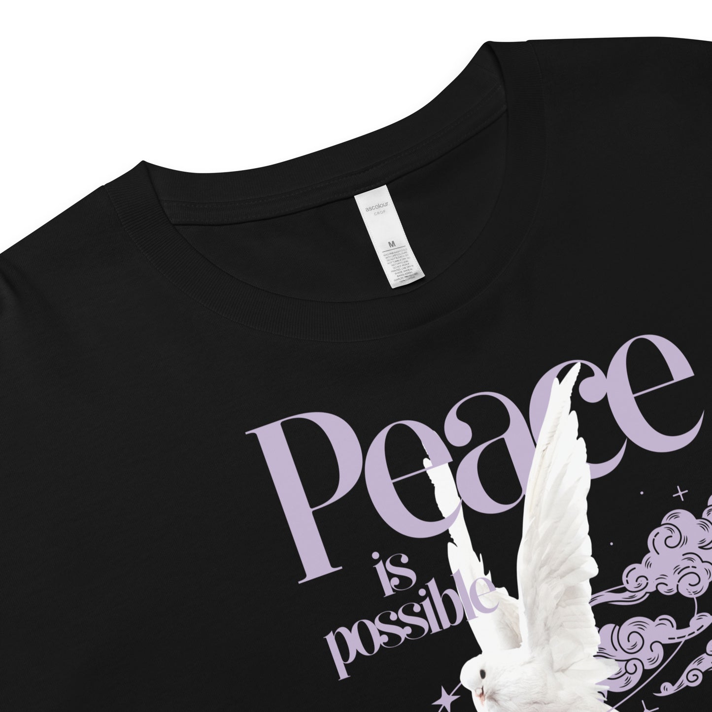 Black t-shirt with 'Peace is possible' text and dove design on a white background
