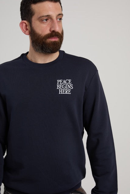black shirt with print,peace begins here