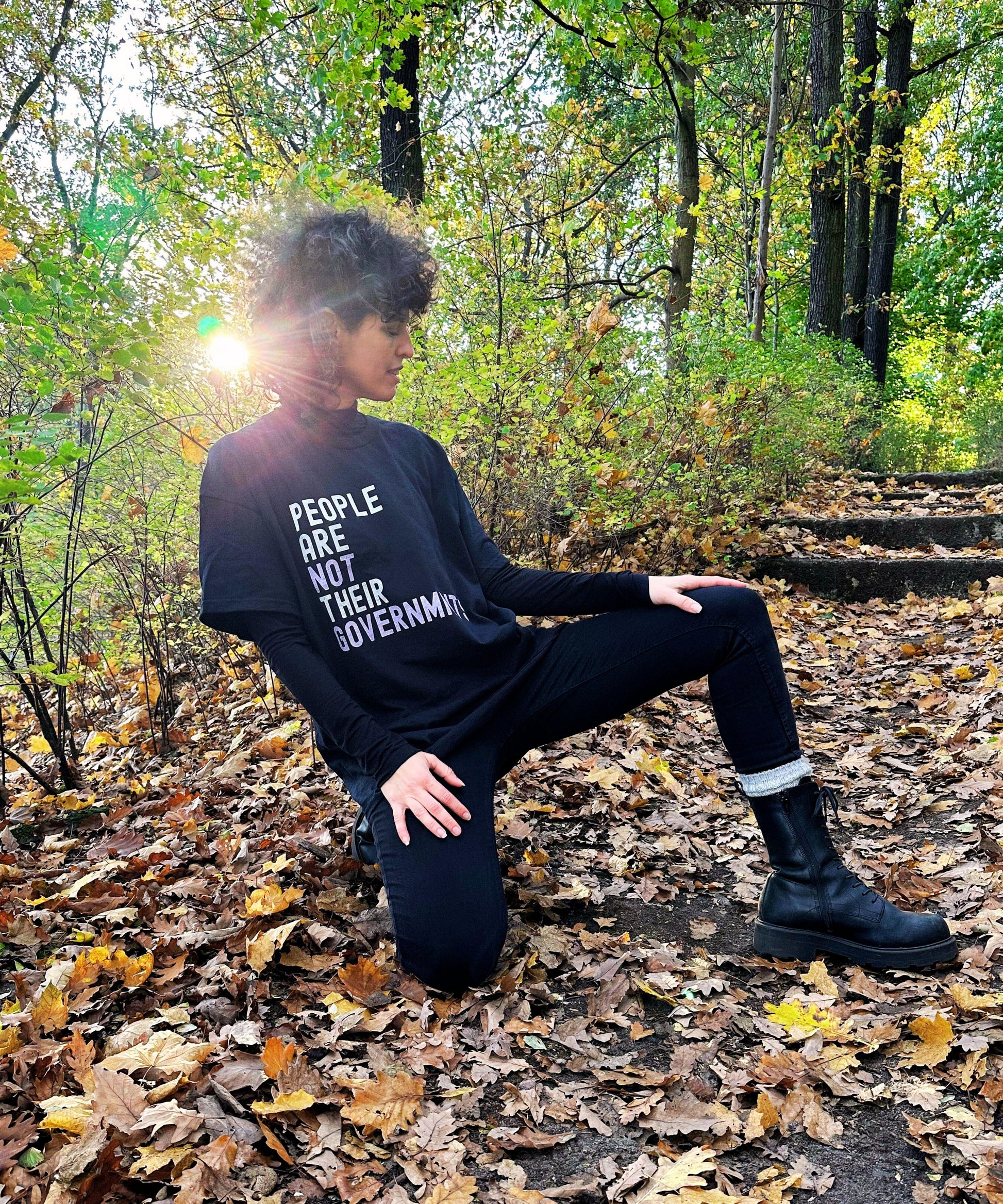 woman wearing black shirt with print is an autum setting