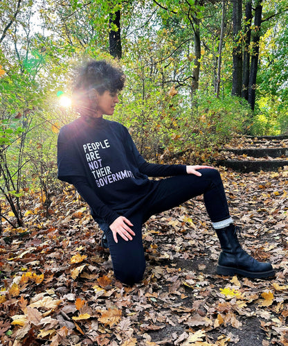 woman wearing black shirt with print is an autum setting