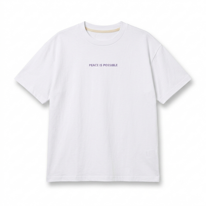 Organic cotton white unisex t-shirt with purple/ lila embroidery: peace is possible