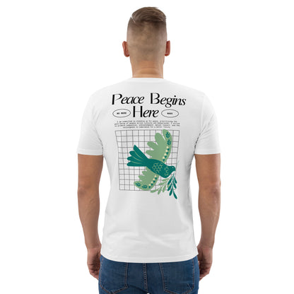 Person wearing a white t-shirt with 'Peace Begins Here' design on the back.